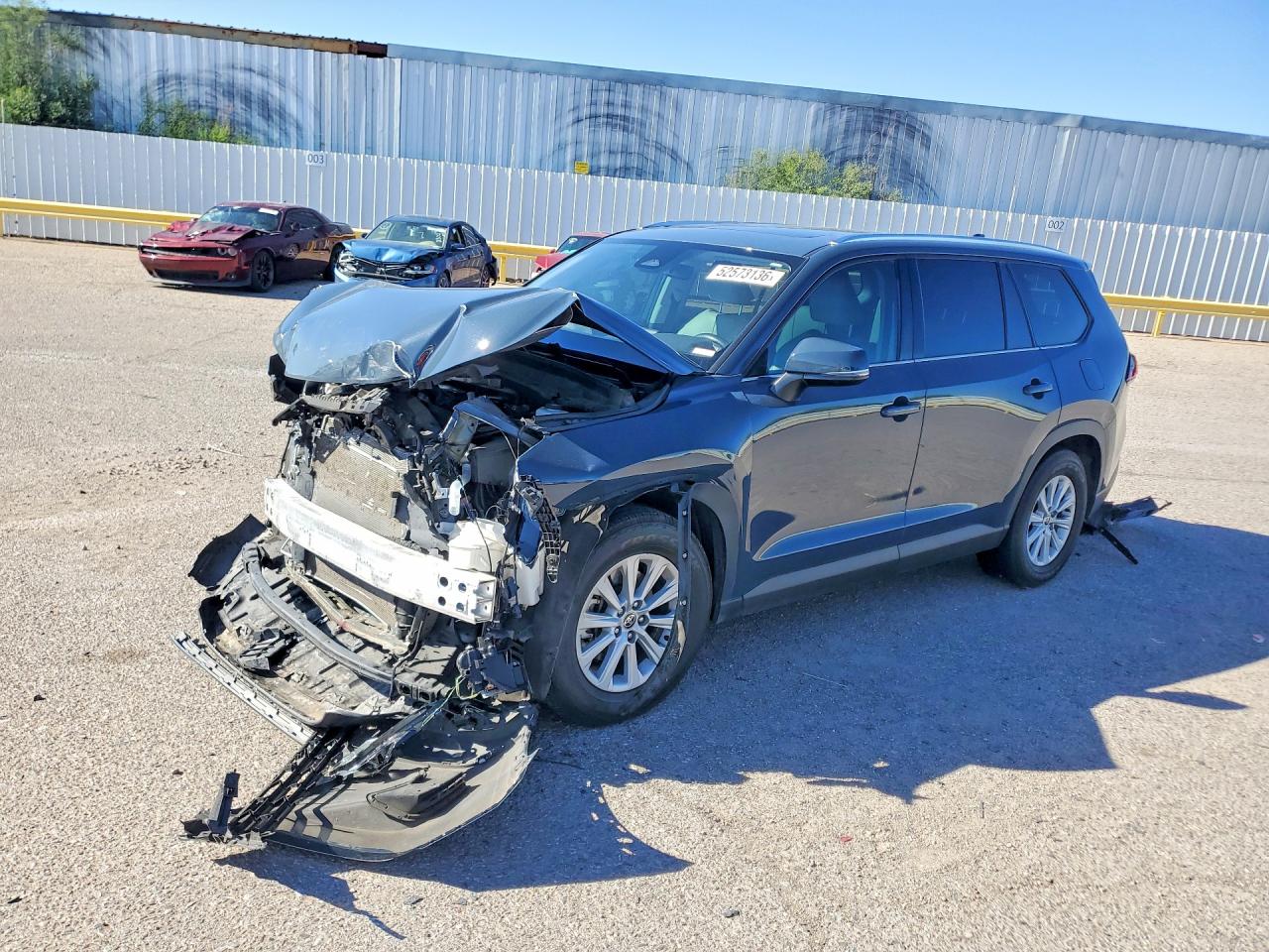 Salvage Toyota Grand High Image